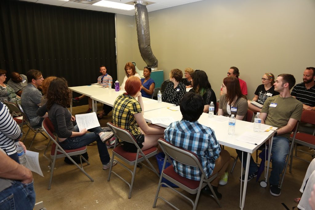 Team gathered around a long table during a planning session